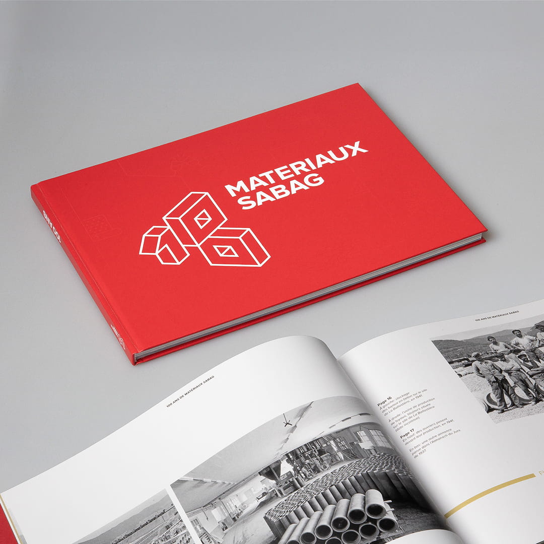Conception et mise en page d’un livre anniversaire retraçant 100 ans d’histoire des Matériaux Sabag.